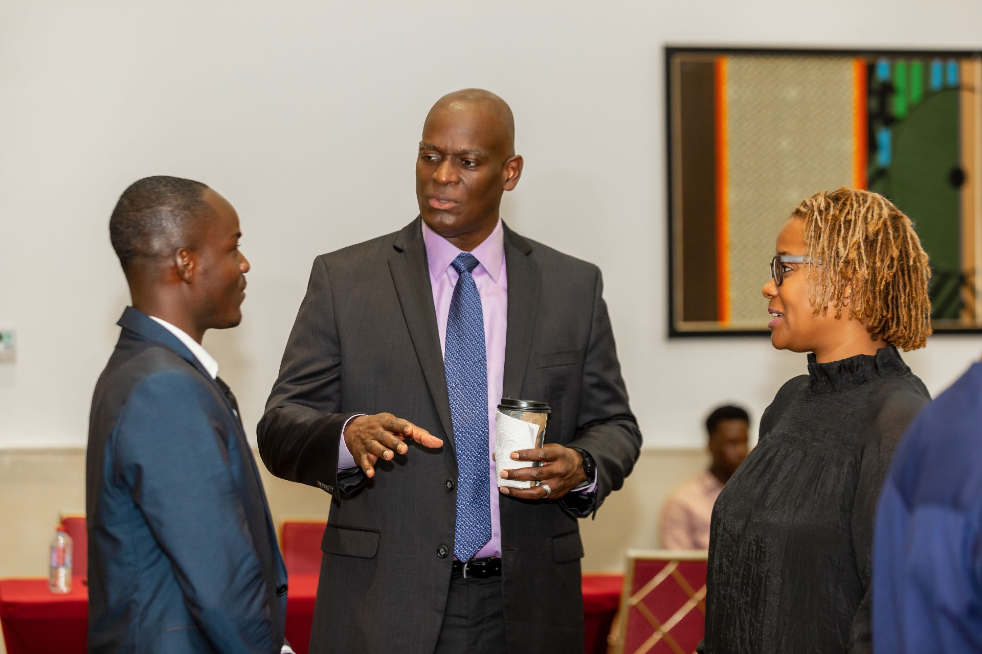 Two men and a woman having a conversation