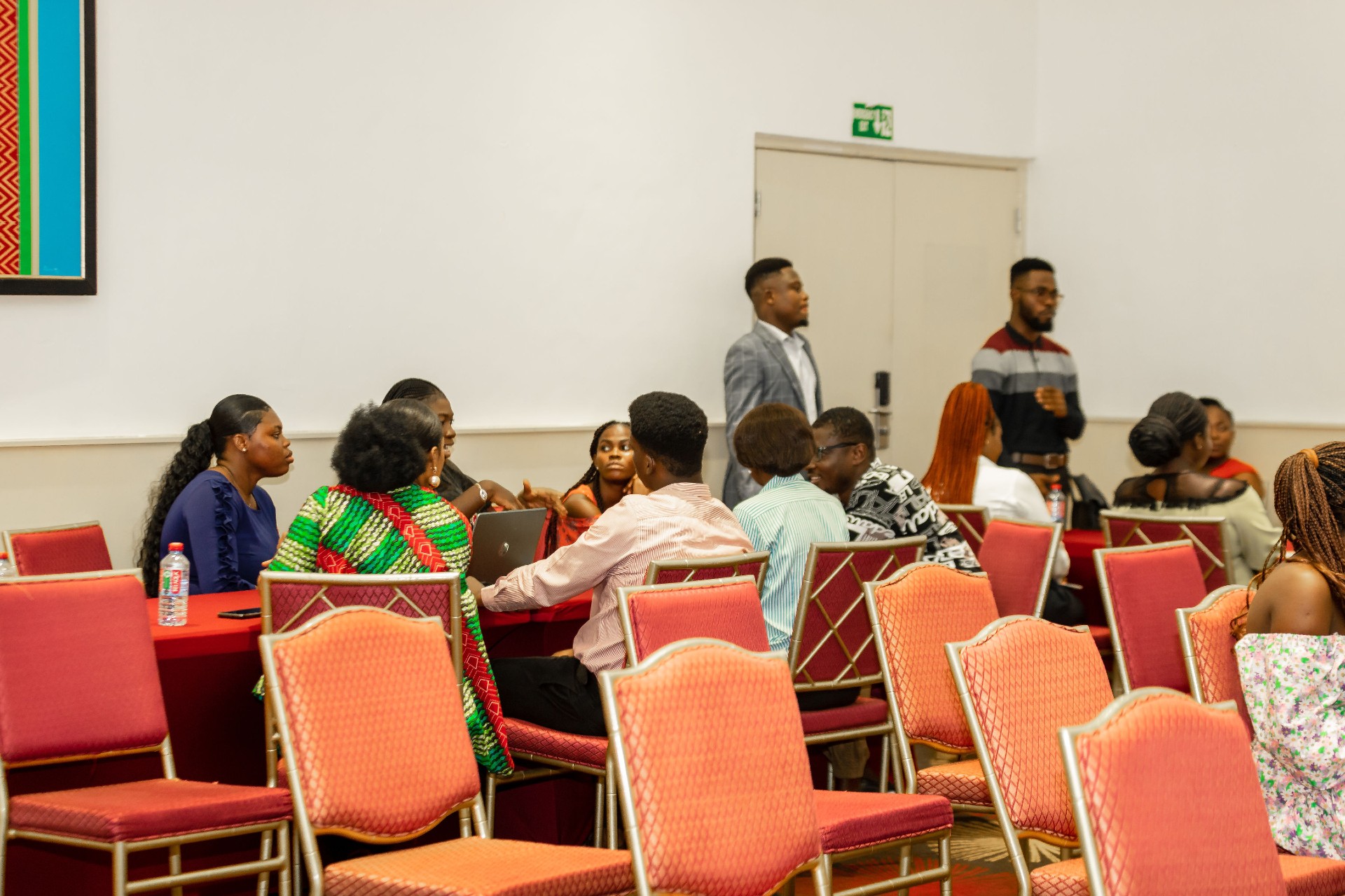 People gathered around a table having a discussion