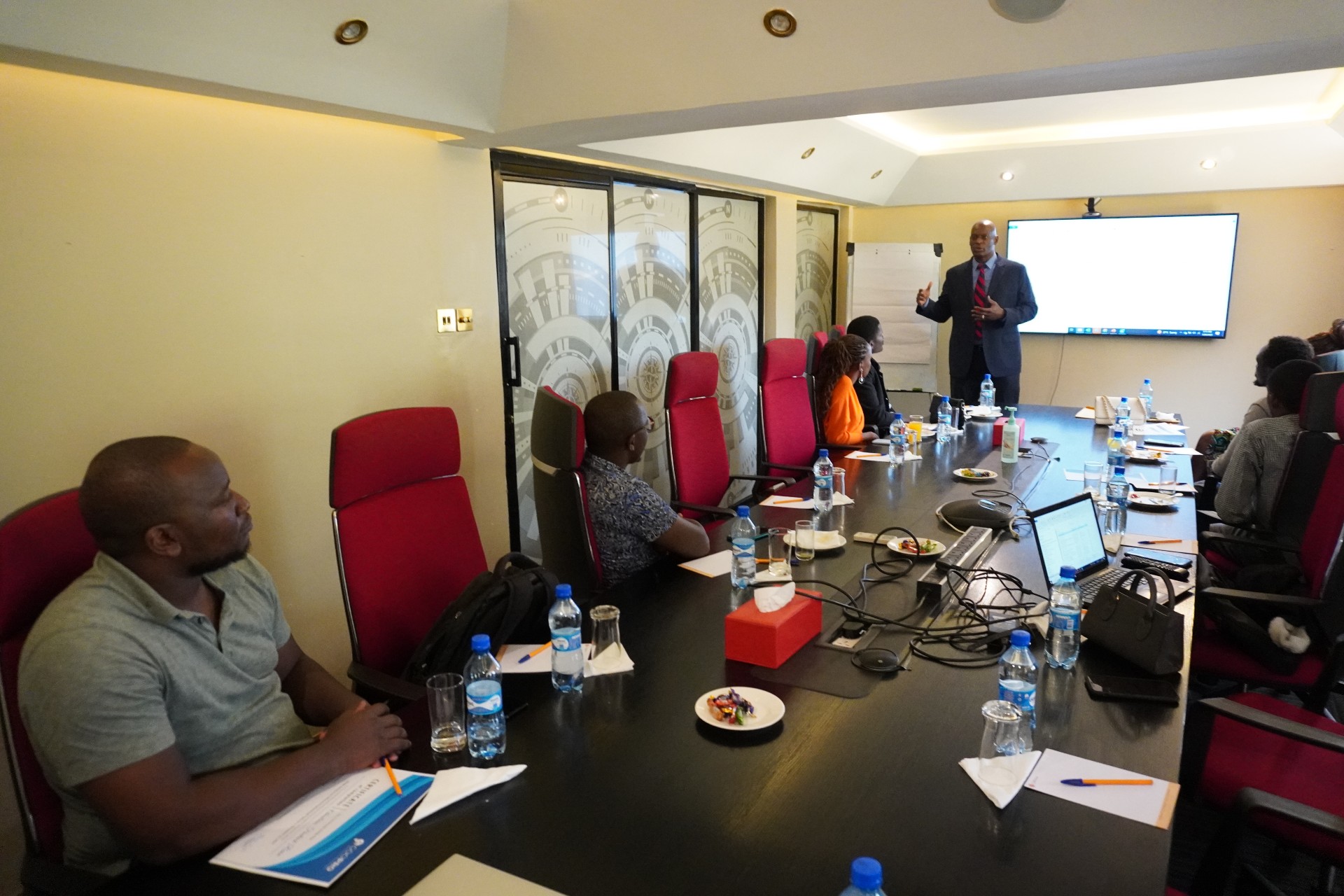 People paying attention to a presentation being done in a boardroom